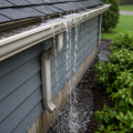 Water overflowing from a clogged residential gutter